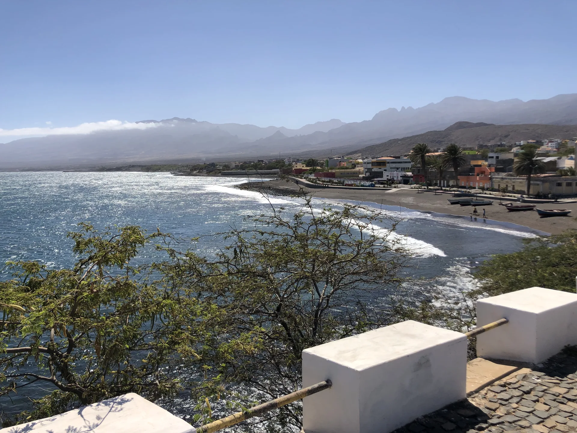 Coastal town on Santo Antão with a black-sand beach and mountains in the distance