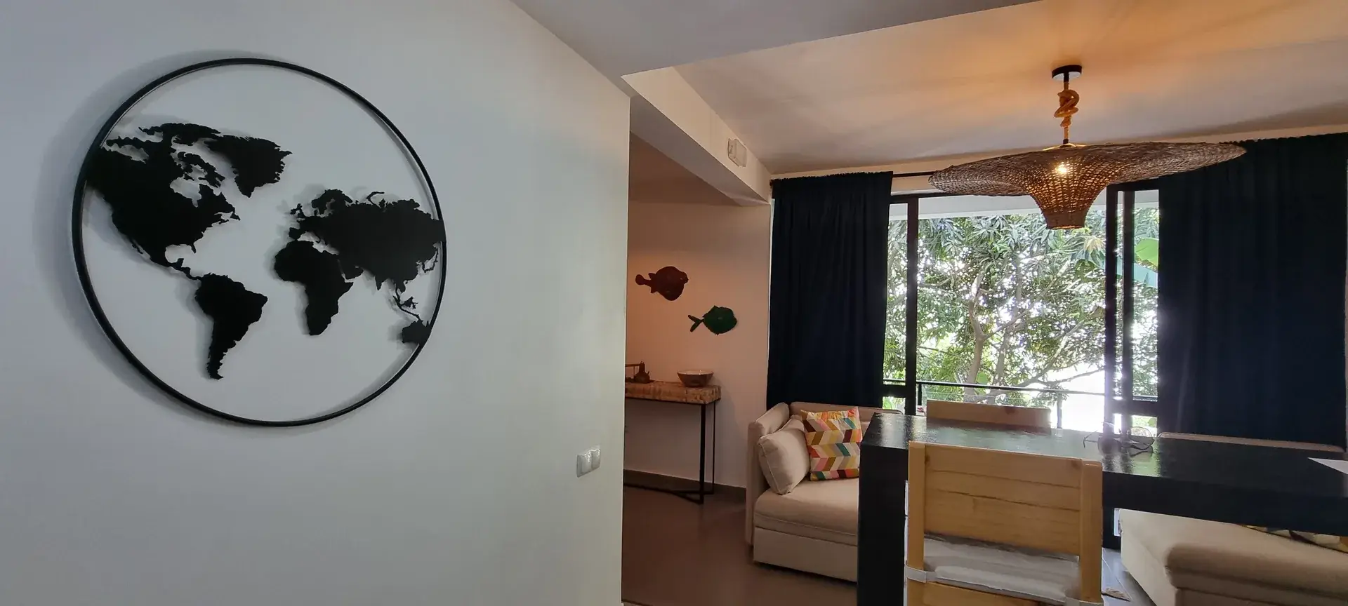 Green Room dining and living area with large windows overlooking the garden