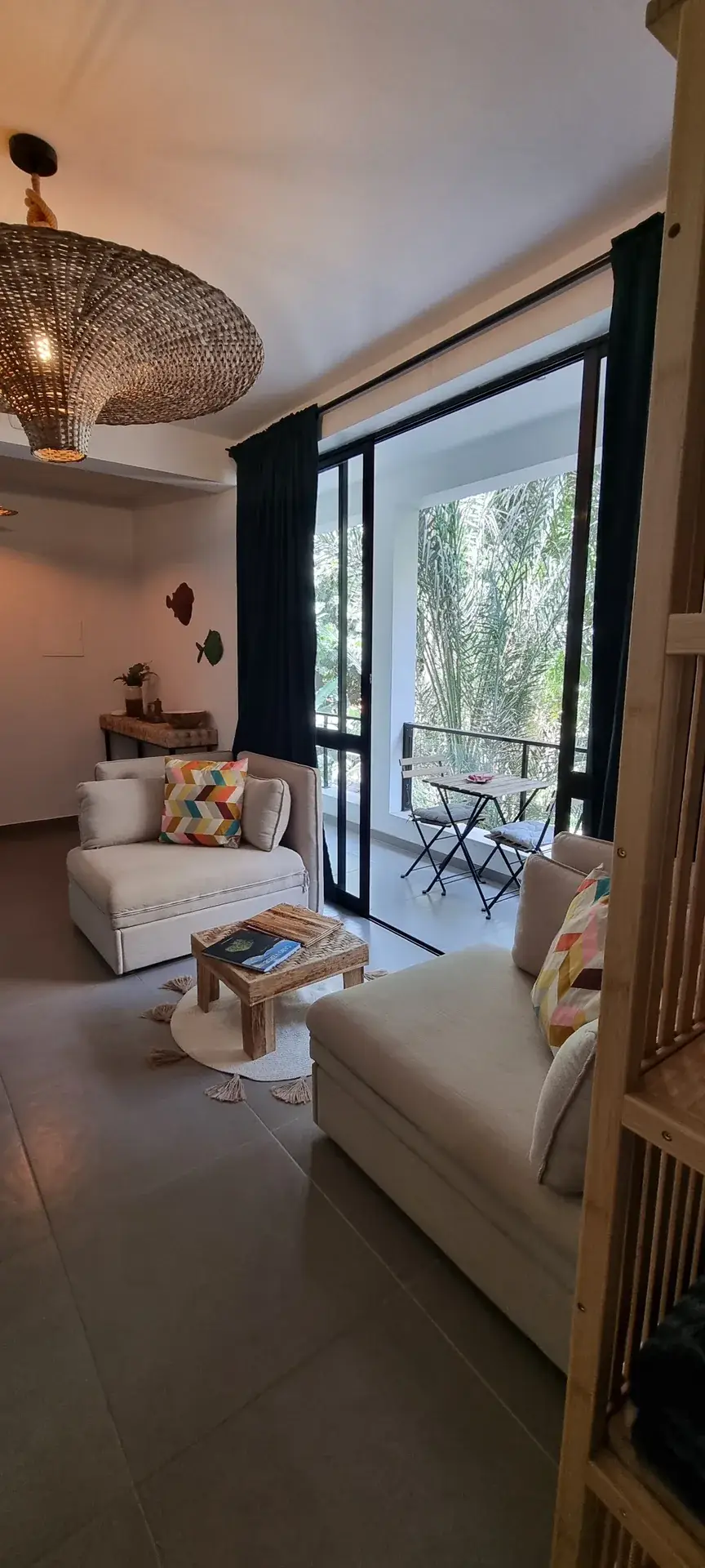 Cosy seating area and private balcony in the Green Room at Kasa d’Vizin