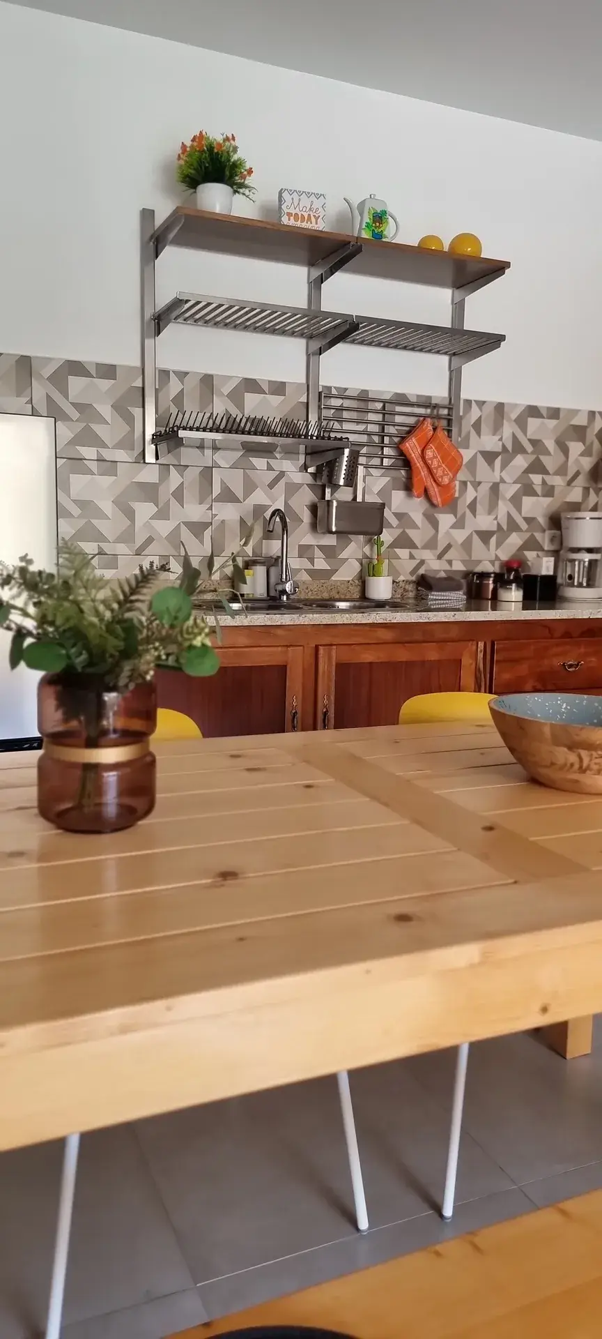 Dining table and kitchen area in the Orange Room apartment