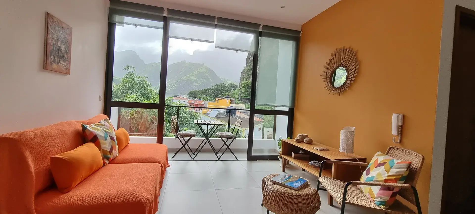 Wicker seating in the Orange Room with access to the private balcony