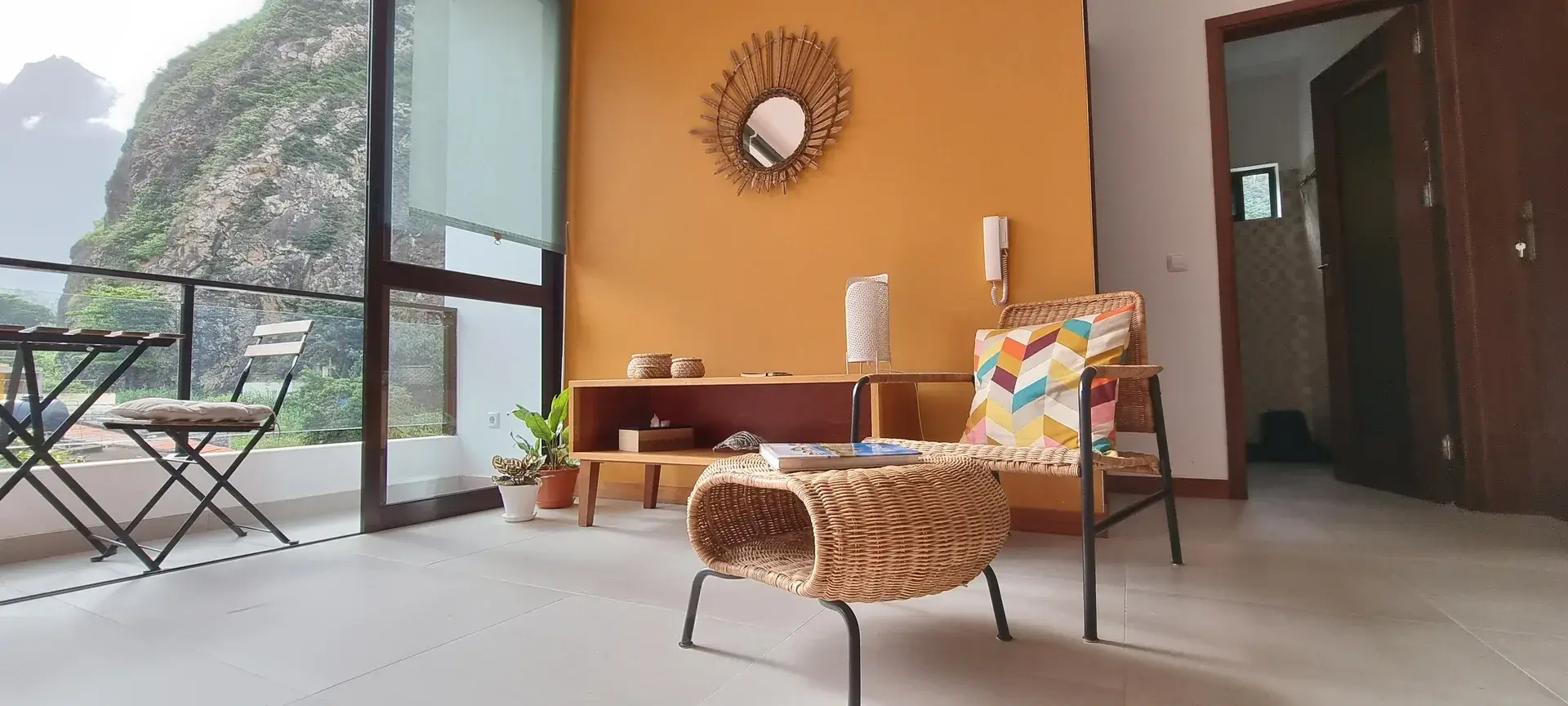 Spacious Orange Room living area and balcony overlooking Eito and the mountains