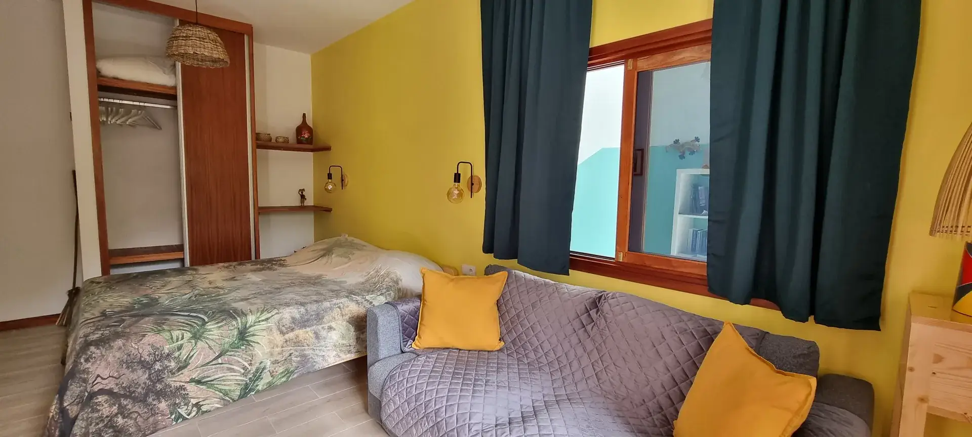 Yellow Room sleeping and seating area with a double bed and sofa bed