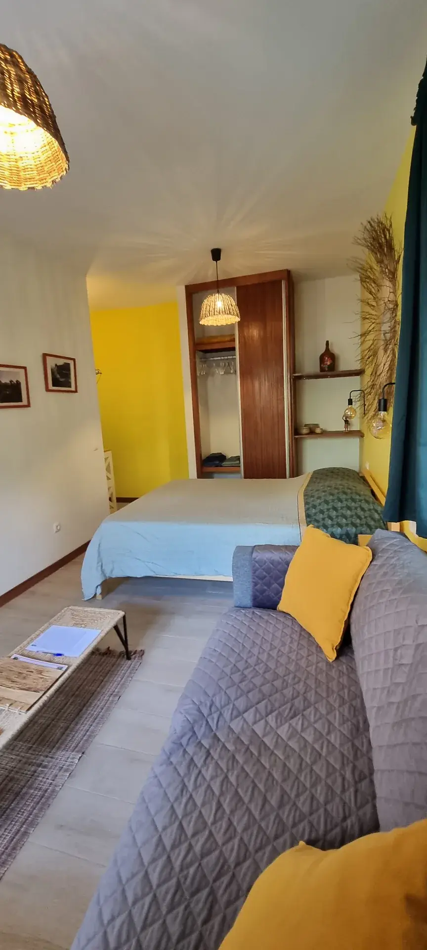 Double bed and sofa bed beside the garden-facing windows in the Yellow Room