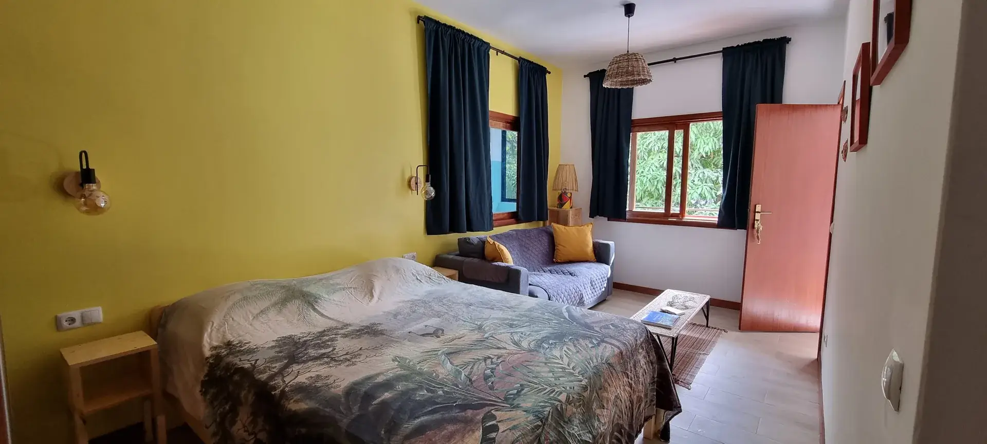 Yellow Room at Kasa d'Vizin, an ensuite double with a double bed, sofa bed and garden view in Santo Antão.